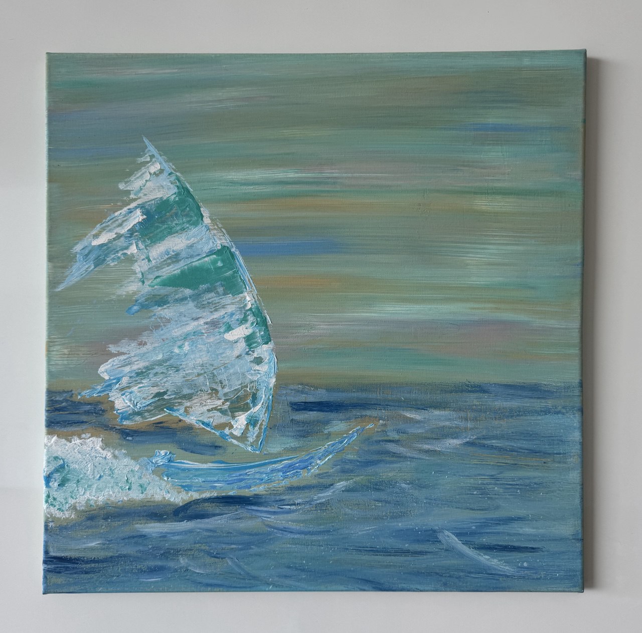 A sailboat with a bright, textured sail glides across layered blue water beneath a muted, streaked sky.